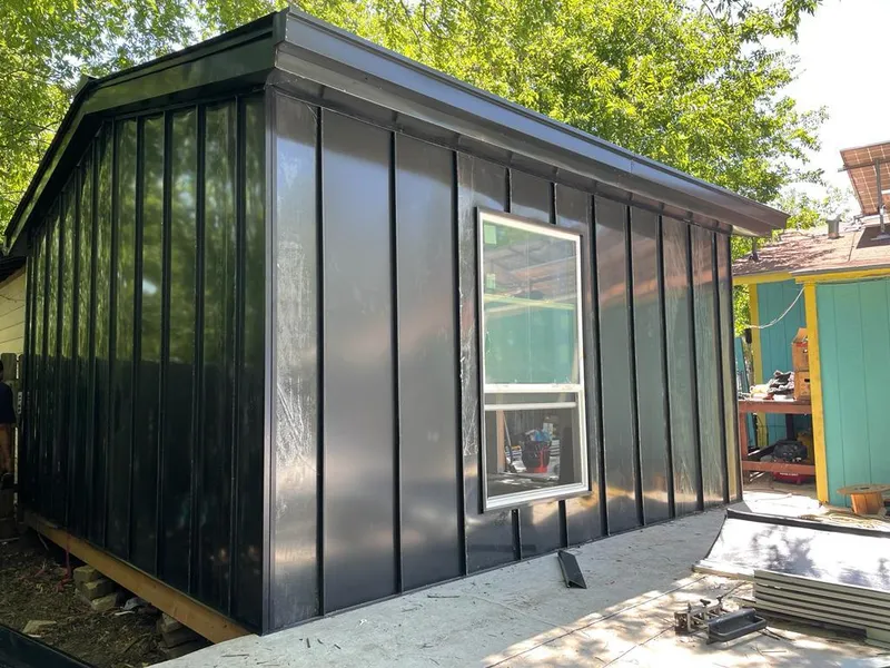 Black standing seam metal wall panels for Metal Roof Installation in Marble Falls