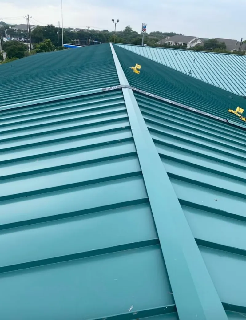 Green commercial metal roof ridge and valley for Metal Roof Repair in Marble Falls