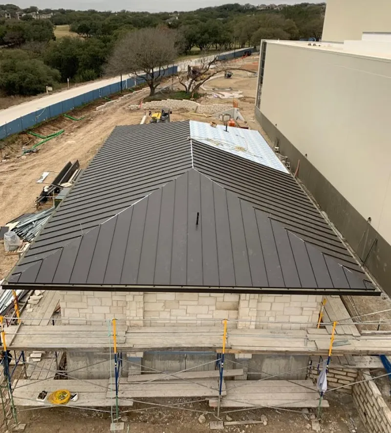 Metal roof new construction with scaffolding in Marble Falls