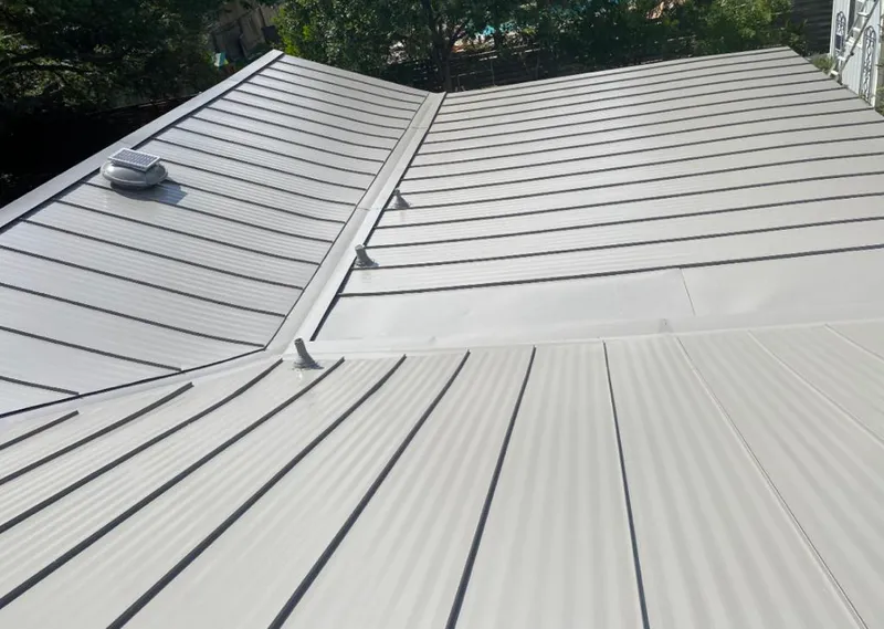 Solar attic fan installed on a metal roof for Roof Ventilation in Marble Falls