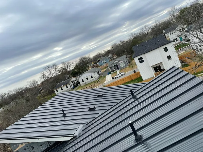 Standing seam metal roof panels with vents for Skylight Repair in Marble Falls